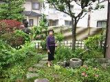 Yoshikawa-san in front of her house